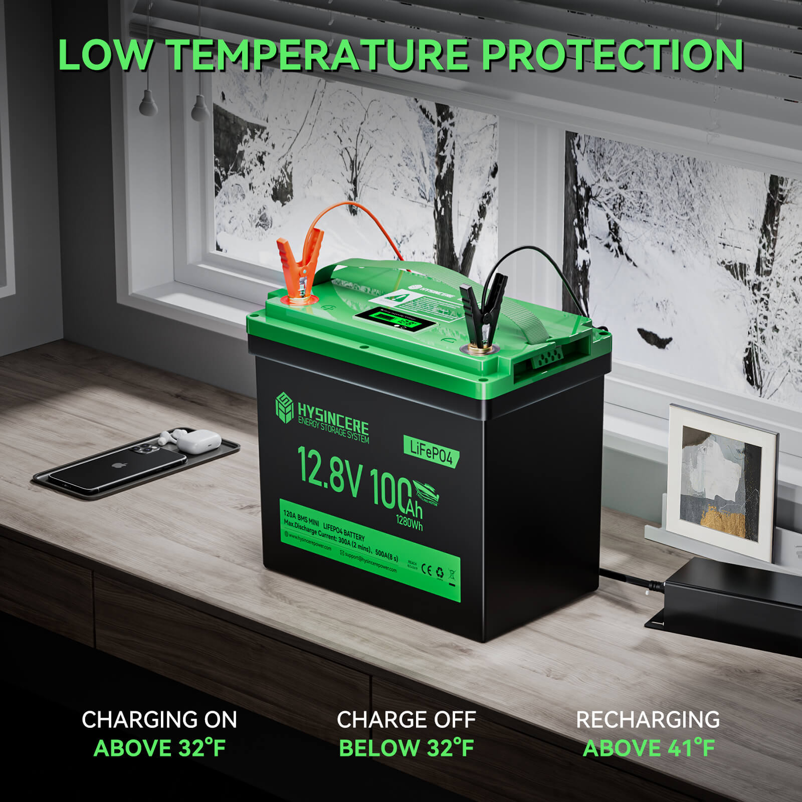 Green and black battery on a wooden surface with text about low temperature protection.